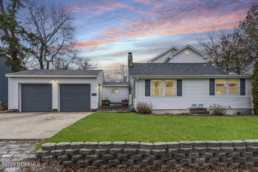 40 Pinehurst Road Brick, NJ 08723 - Photo 1 of 47 a front view of a house with a yard and garage