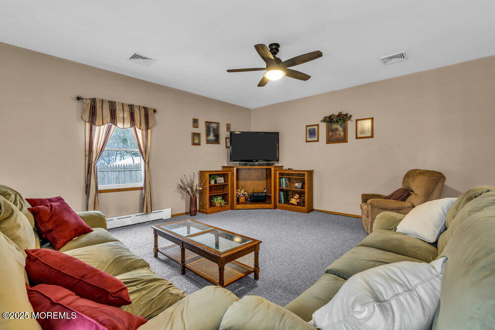 40 Pinehurst Road Brick, NJ 08723 - Photo 28 of 47 a living room with furniture and a window