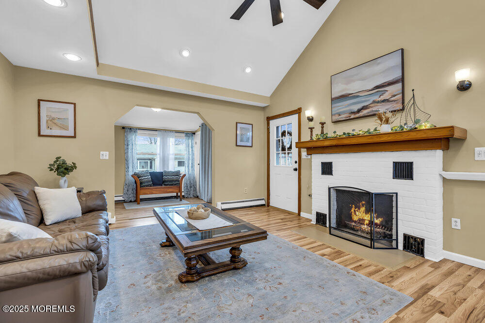 40 Pinehurst Road Brick, NJ 08723 - Photo 9 of 47 a living room with furniture and a fireplace