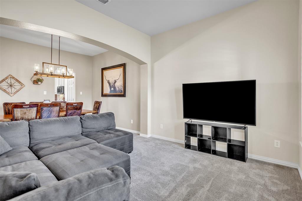 12286 Emerald Ranch Lane North Forney, TX 75126 - Photo 7 of 40 a living room with furniture and a flat screen tv