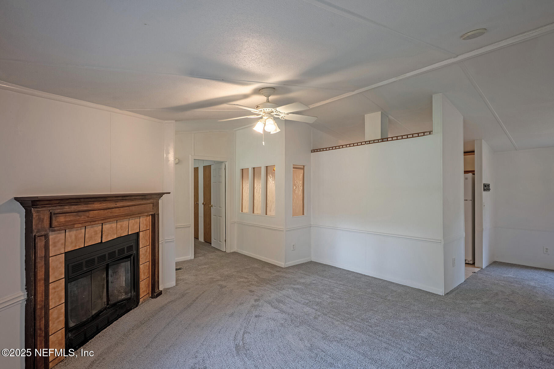 8105 Colee Cove Road St. Augustine, FL 32092 - Photo 11 of 44 a view of a livingroom with an empty space and a fireplace