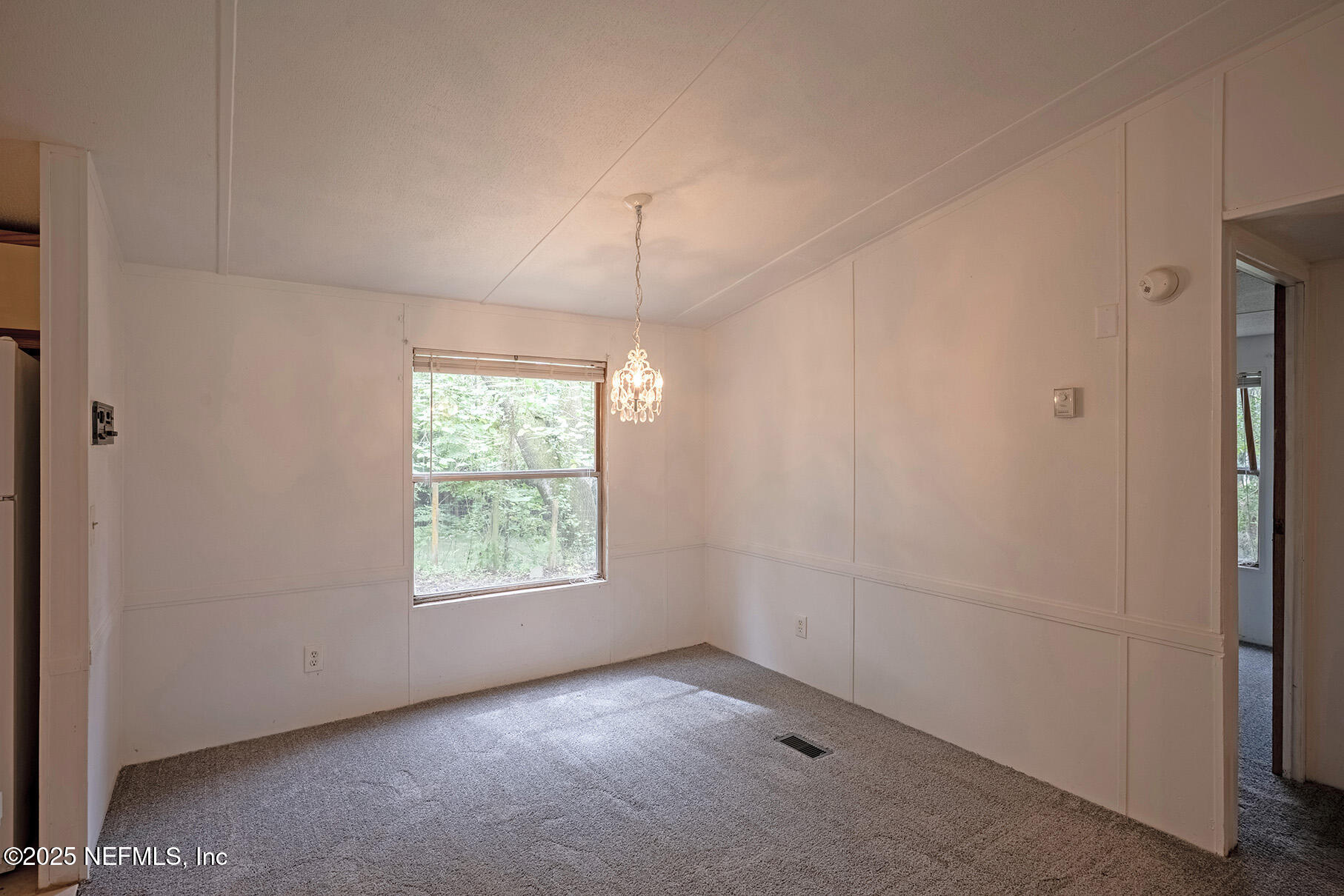 8105 Colee Cove Road St. Augustine, FL 32092 - Photo 13 of 44 an empty room with windows and closet