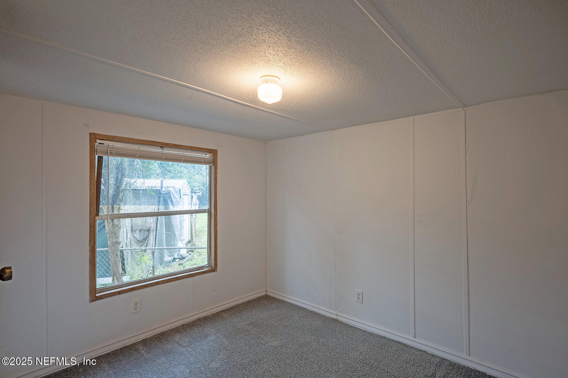 8105 Colee Cove Road St. Augustine, FL 32092 - Photo 24 of 44 an empty room with a window