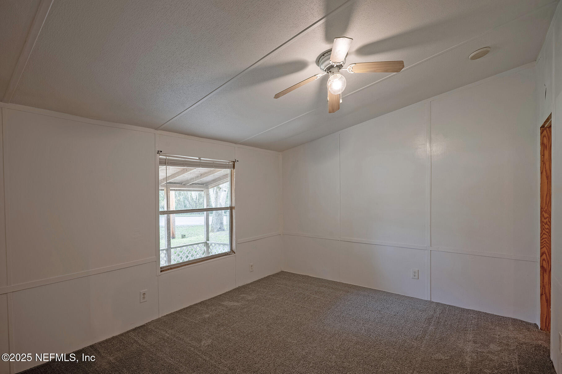 8105 Colee Cove Road St. Augustine, FL 32092 - Photo 25 of 44 an empty room with windows and fan