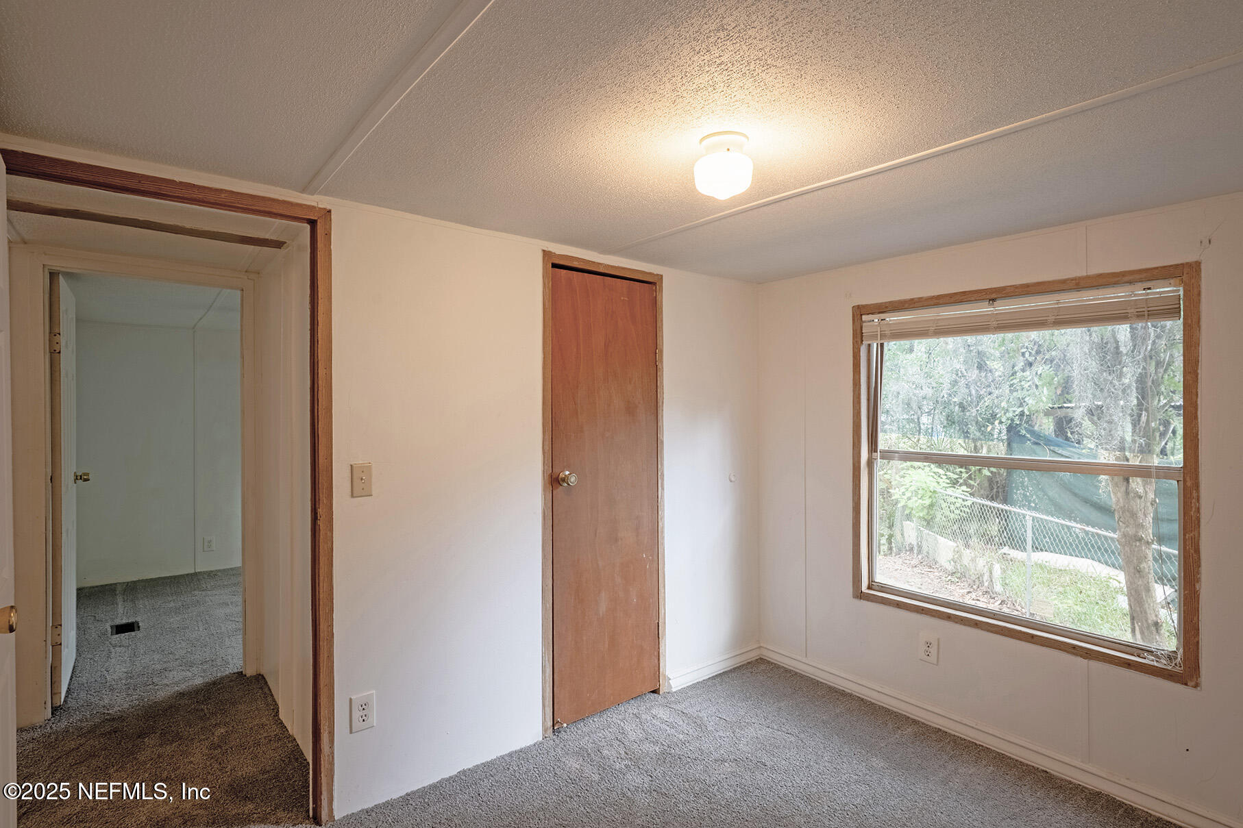 8105 Colee Cove Road St. Augustine, FL 32092 - Photo 28 of 44 a view of an empty room with a window