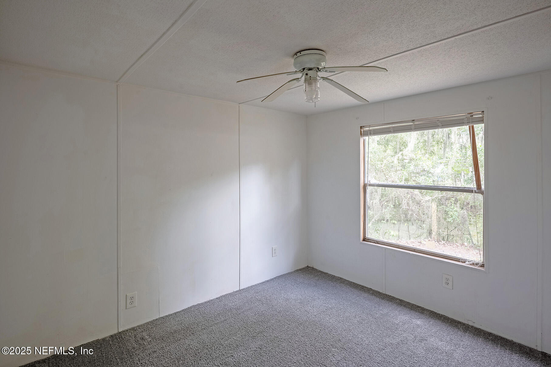 8105 Colee Cove Road St. Augustine, FL 32092 - Photo 30 of 44 a view of an empty room with a window