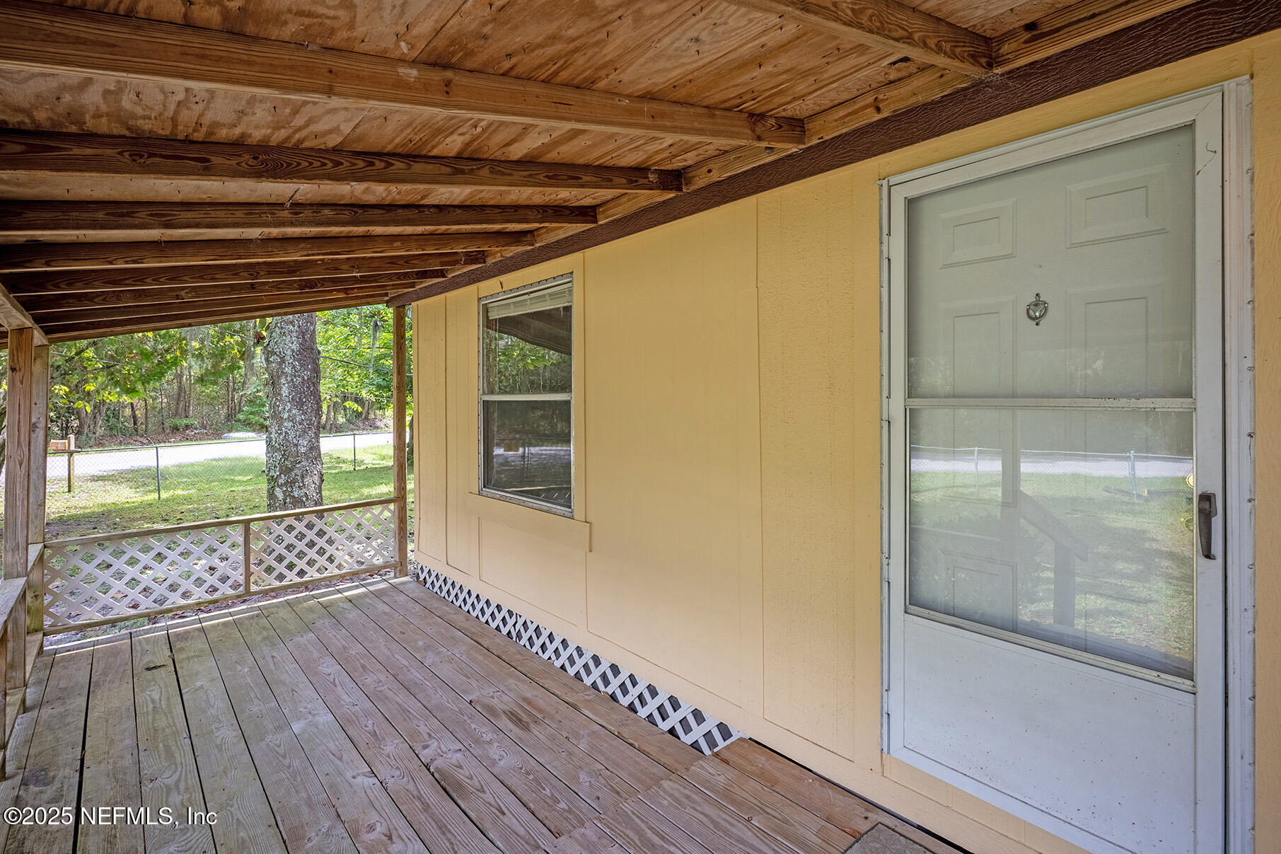 8105 Colee Cove Road St. Augustine, FL 32092 - Photo 3 of 44 a view of empty room with wooden floor and fan