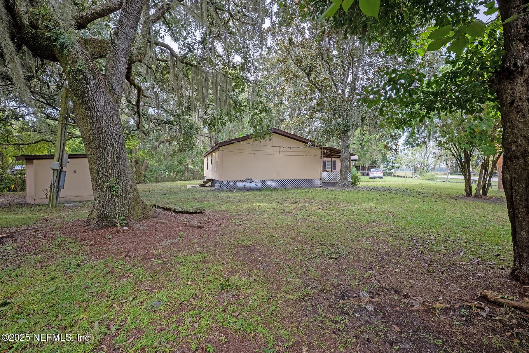 8105 Colee Cove Road St. Augustine, FL 32092 - Photo 41 of 44 a view of a house with backyard and trees