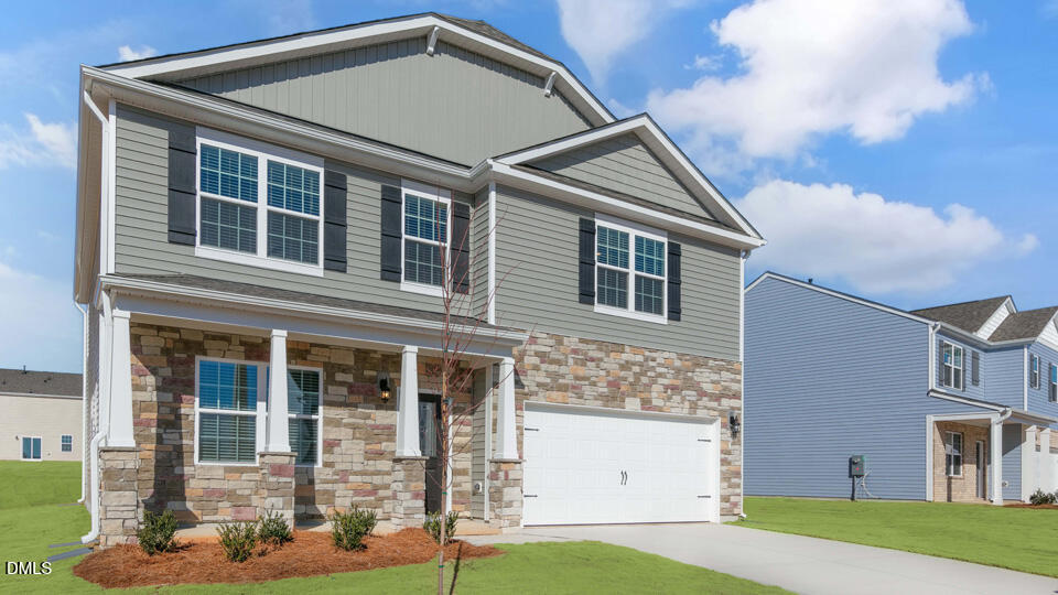 1316 Pavo Path Wendell, NC 27591 - Photo 2 of 54 a front view of a house with a yard