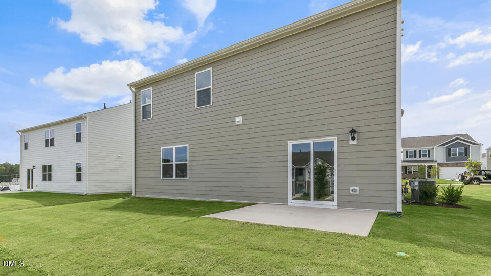 1316 Pavo Path Wendell, NC 27591 - Photo 40 of 54 a view of a backyard with plants and a garden