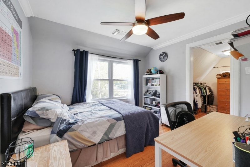 759 Ridgewood Road Millburn, NJ 07041 - Photo 12 of 16 a bedroom with a bed and a large dresser