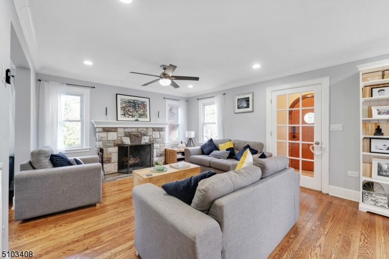 759 Ridgewood Road Millburn, NJ 07041 - Photo 2 of 16 a living room with fireplace furniture and a wooden floor