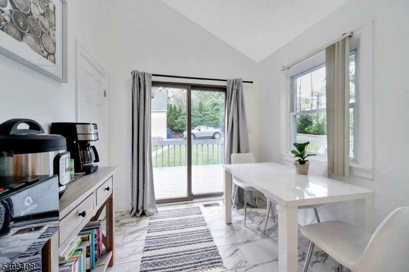 759 Ridgewood Road Millburn, NJ 07041 - Photo 6 of 16 a view of a dining room with furniture window and outside view