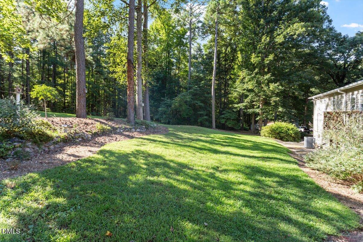 2129 Kelly Road Apex, NC 27502 - Photo 12 of 64 a view of a backyard