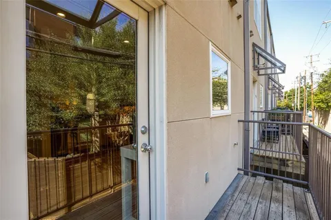 a backyard of a house with outdoor seating