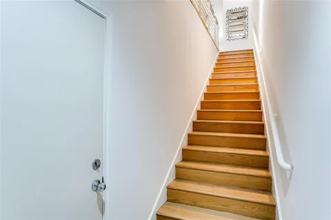 a table with a potted plant and a window
