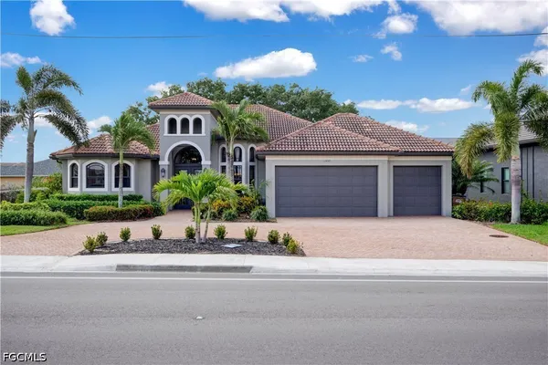 $695,000 | 1406 Cape Coral Parkway West, Cape Coral, FL 33914