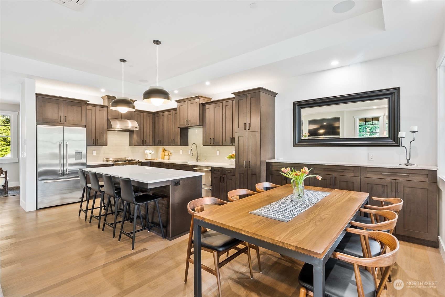 677 Larkspur Loop Cle Elum, WA 98922 - Photo 12 of 38 a dining table with chairs and kitchen view