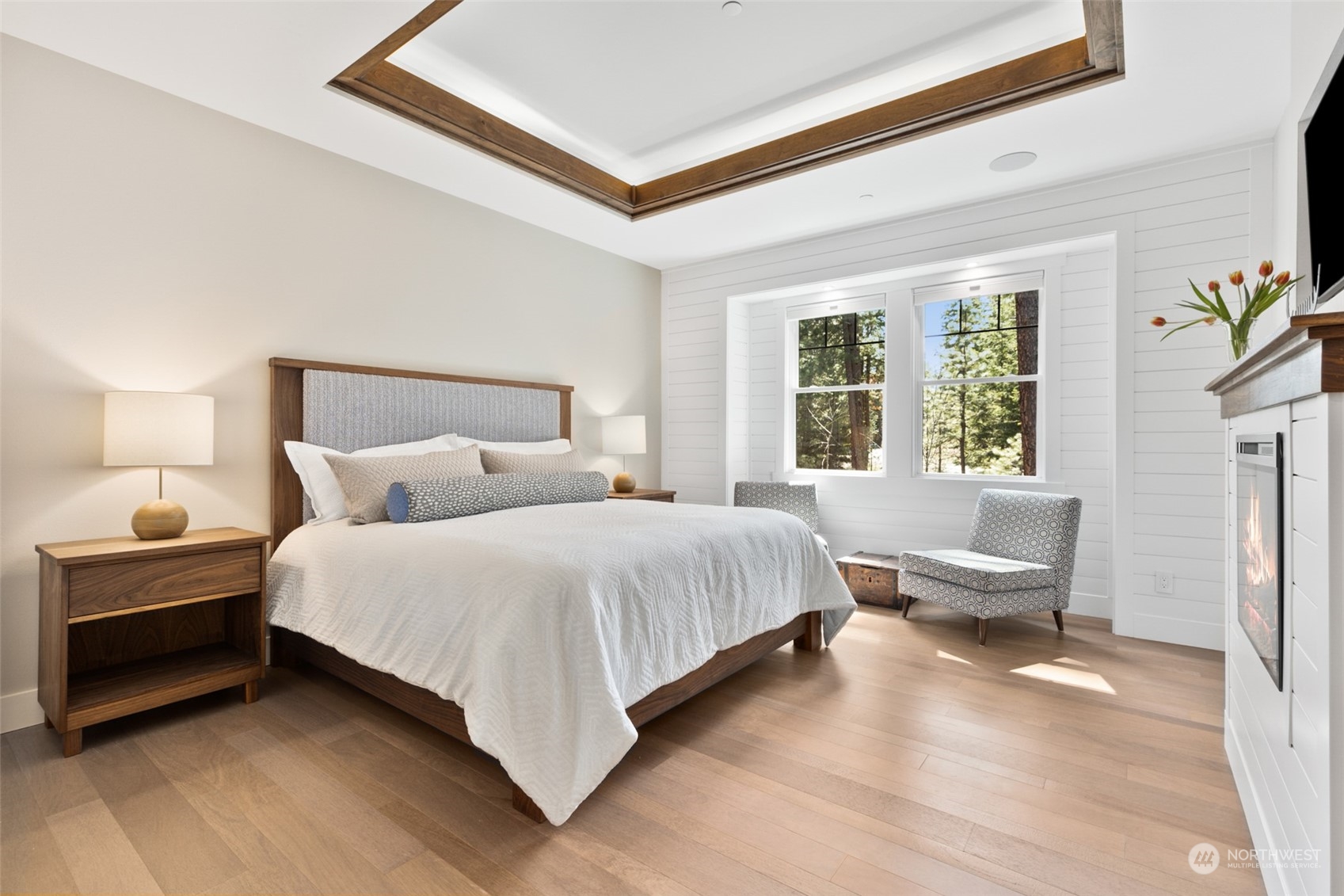 677 Larkspur Loop Cle Elum, WA 98922 - Photo 15 of 38 a bedroom with a bed a couch and a large window