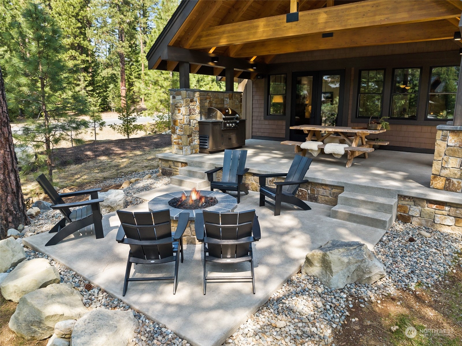 677 Larkspur Loop Cle Elum, WA 98922 - Photo 27 of 38 a view of a patio with table and chairs and potted plants