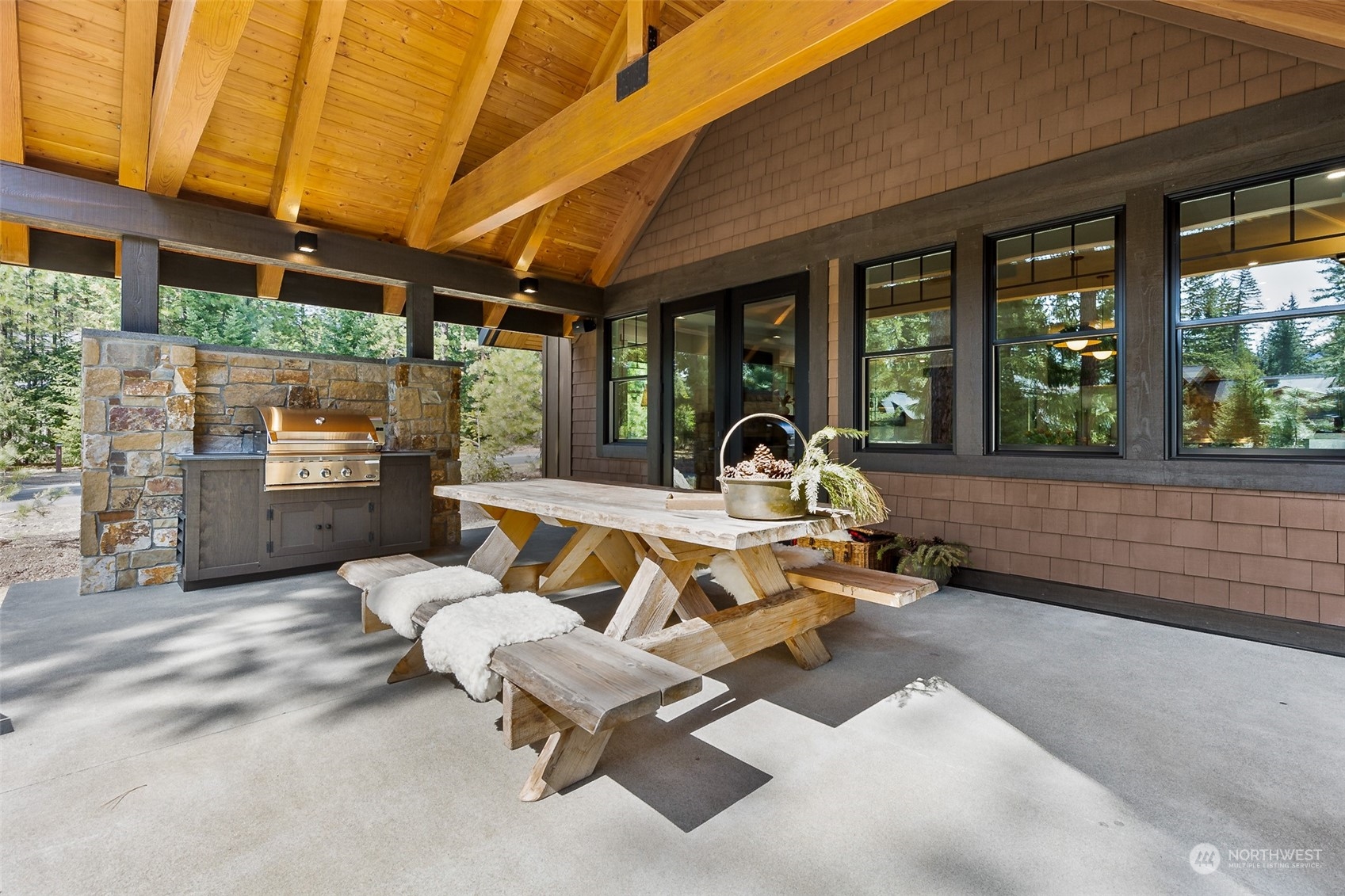 677 Larkspur Loop Cle Elum, WA 98922 - Photo 29 of 38 a view of a patio with a table and chairs next to a yard