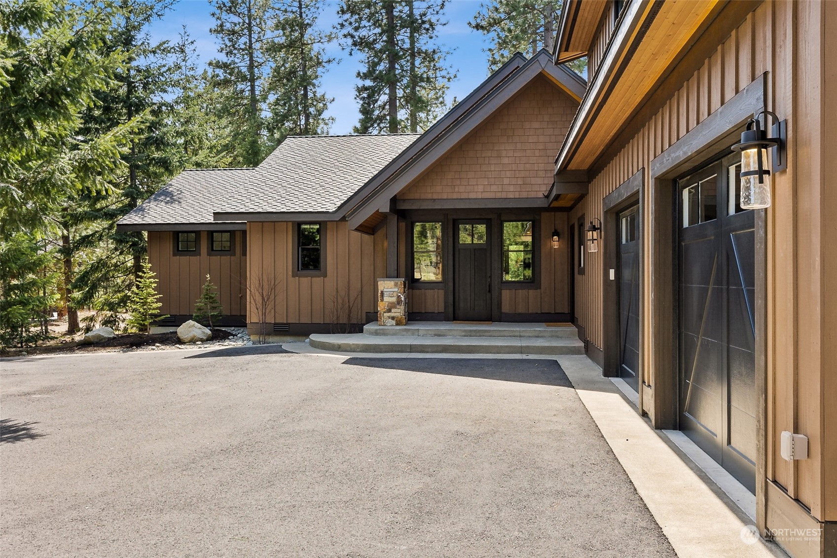 677 Larkspur Loop Cle Elum, WA 98922 - Photo 3 of 38 a house with trees in front of it