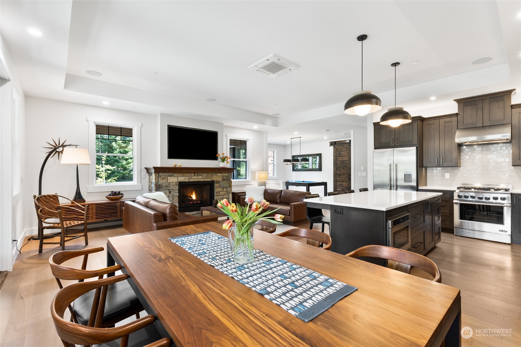 677 Larkspur Loop Cle Elum, WA 98922 - Photo 8 of 38 a living room with furniture a flat screen tv and a fireplace