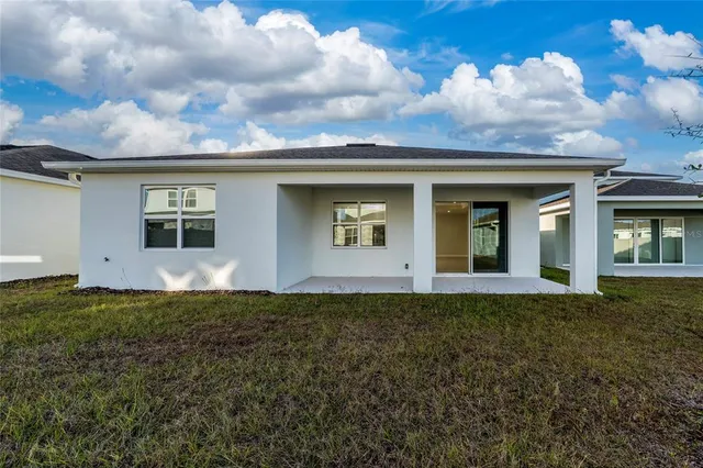 a view of a garden with a patio