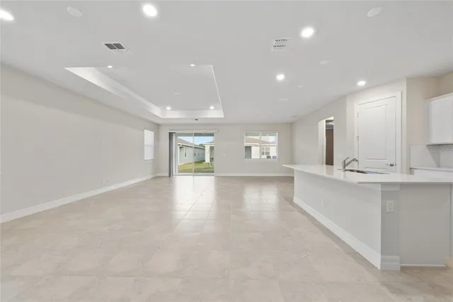 a view of a kitchen with a sink and a window