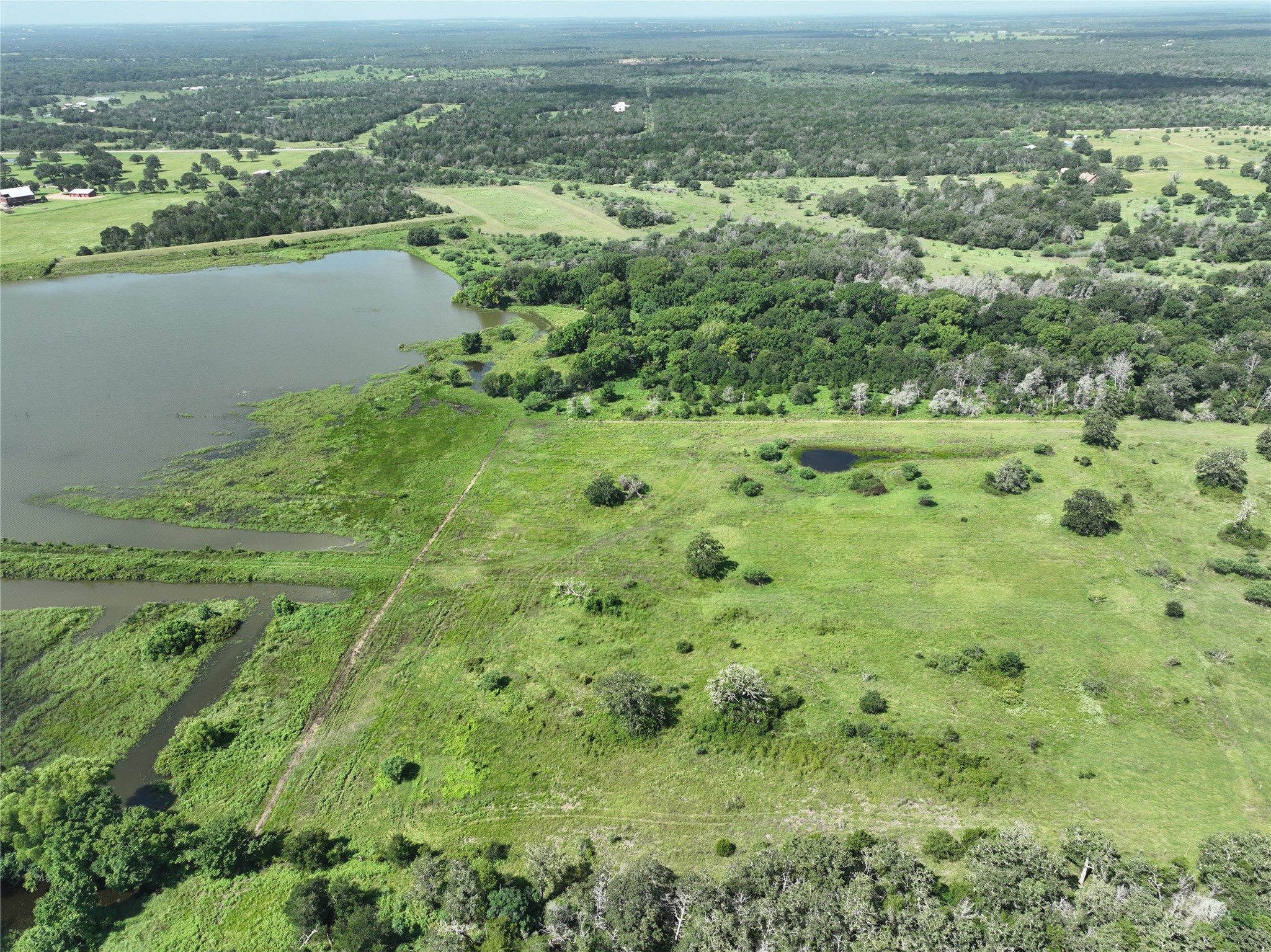 514 Trailer Park Road Carmine, TX 78932 - Photo 9 of 19 a view of a lake with a city