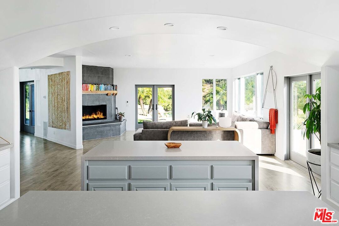 20370 Skyhawk Lane Topanga, CA 90265 - Photo 15 of 43 a living room with furniture and a fireplace