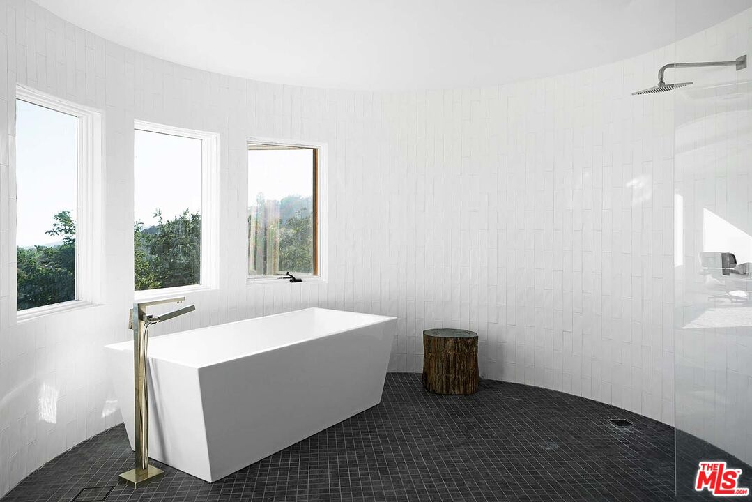 20370 Skyhawk Lane Topanga, CA 90265 - Photo 21 of 43 a room with a bed and a window