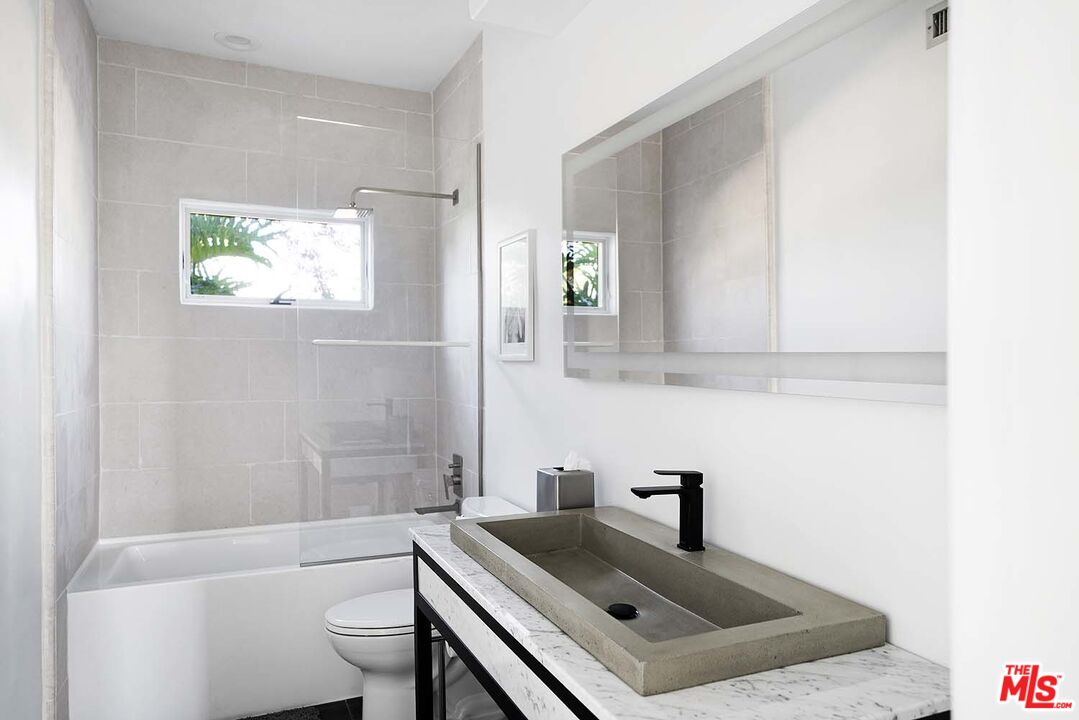 20370 Skyhawk Lane Topanga, CA 90265 - Photo 25 of 43 a bathroom with a sink a toilet and shower