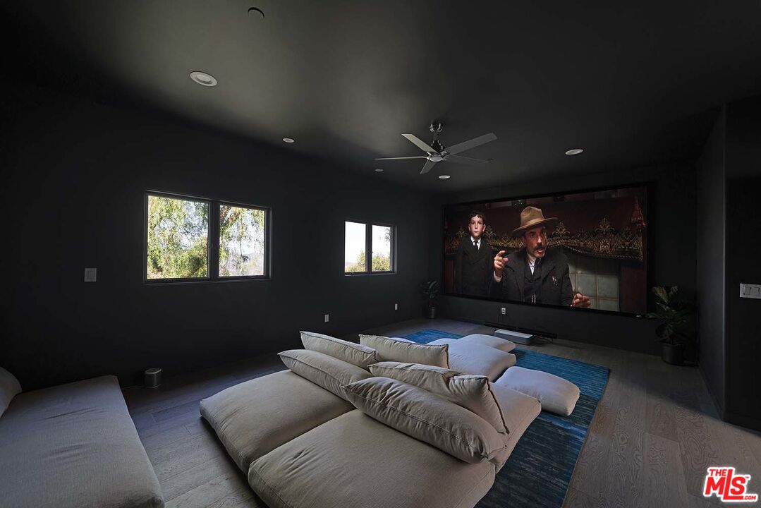 20370 Skyhawk Lane Topanga, CA 90265 - Photo 26 of 43 a living room with furniture and a flat screen tv