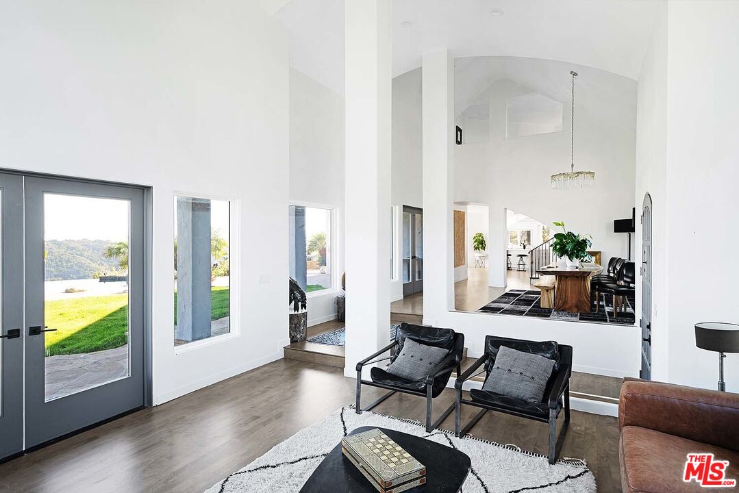 20370 Skyhawk Lane Topanga, CA 90265 - Photo 9 of 43 a living room with furniture and a large window