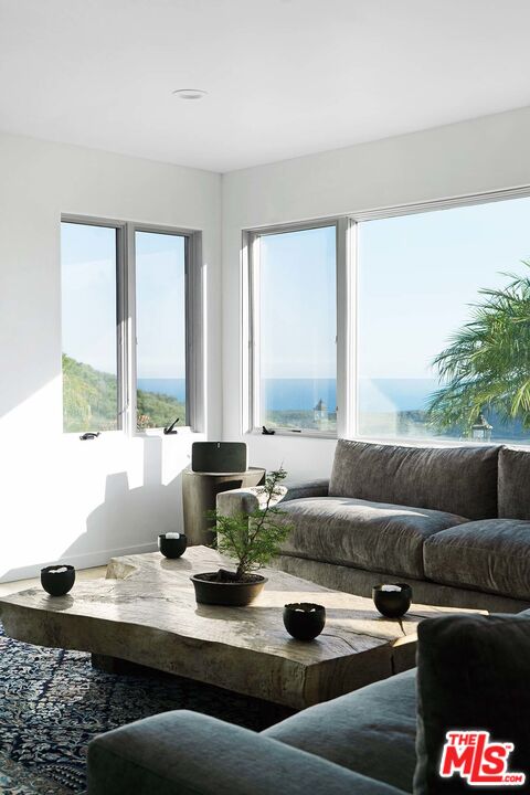 20370 Skyhawk Lane Topanga, CA 90265 - Photo 10 of 43 a living room with furniture and a large window