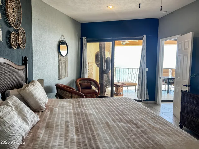 a view of living room with a flat screen tv and potted plant