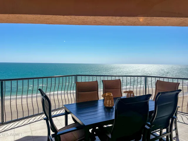 a building view with swimming pool and sitting space
