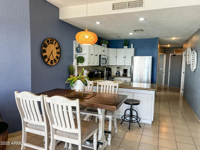 a living room with furniture and a lamp