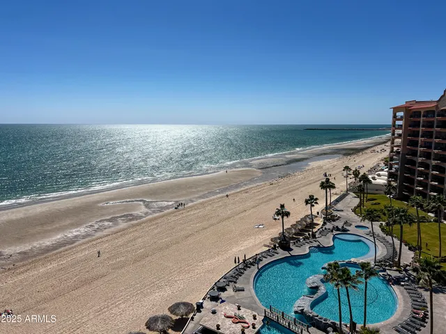 a cafe with a table and chairs in front of it