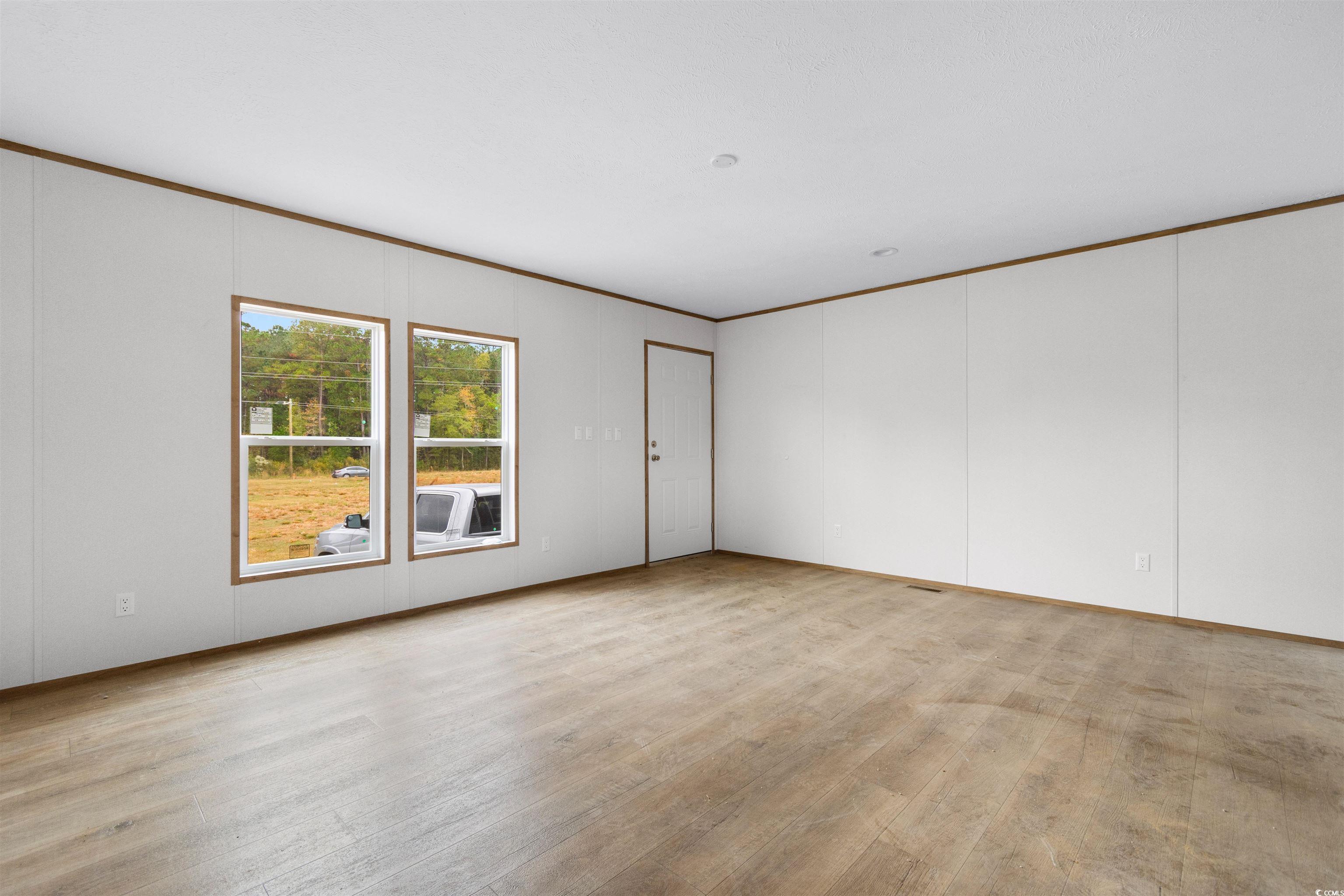 5988 Pleasant View Church Road Nichols, SC 29581 - Photo 12 of 40 Empty room featuring light hardwood / wood-style f