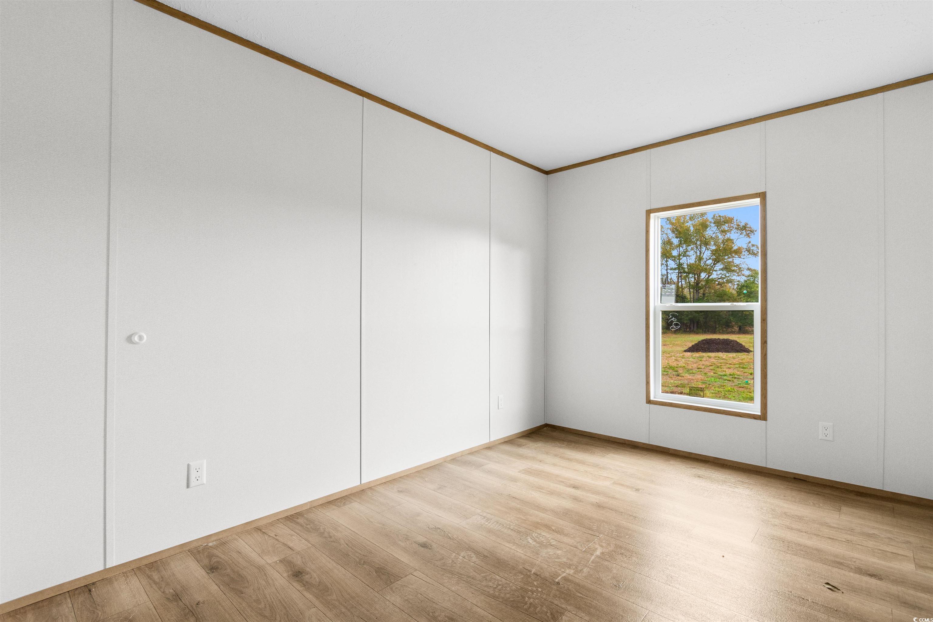 5988 Pleasant View Church Road Nichols, SC 29581 - Photo 23 of 40 Unfurnished room with crown molding and light hard