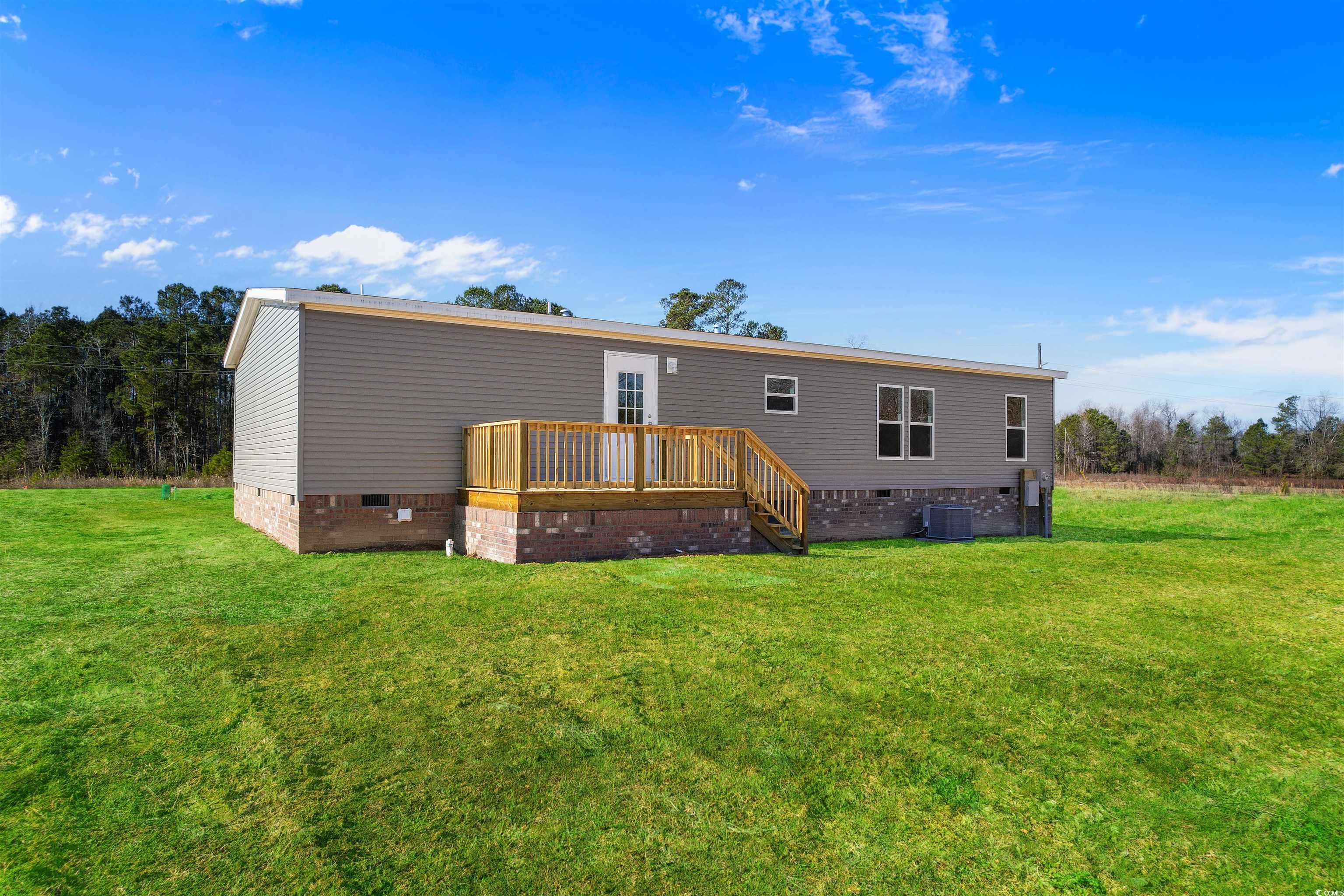 5988 Pleasant View Church Road Nichols, SC 29581 - Photo 32 of 40 Rear view of house featuring central AC, a wooden