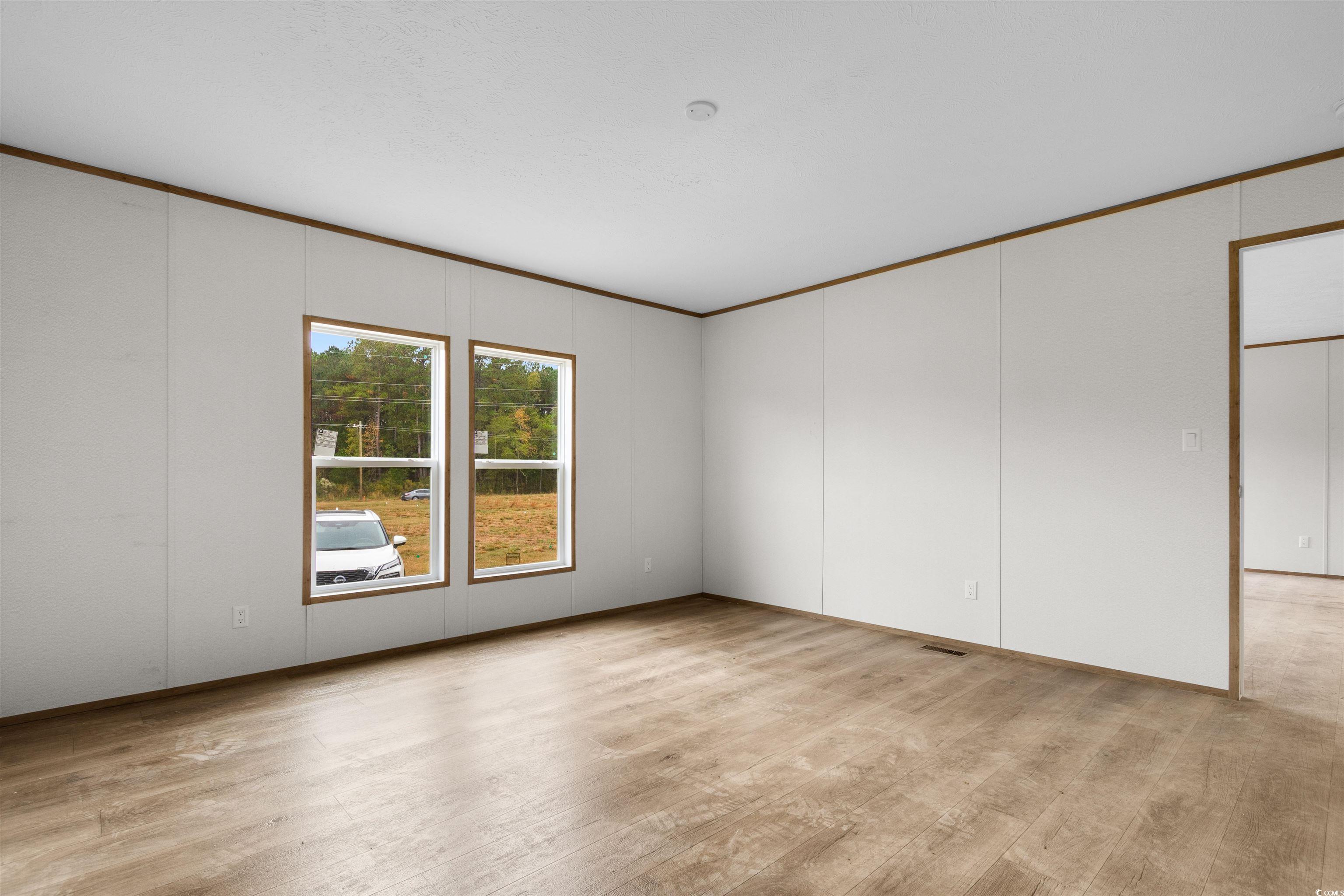 5988 Pleasant View Church Road Nichols, SC 29581 - Photo 8 of 40 Unfurnished room featuring light hardwood / wood-s