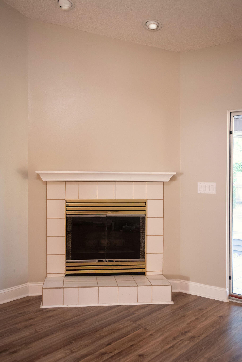4565 Parkwood Court Niceville, FL 32578 - Photo 17 of 48 a view of a livingroom with wooden floor and a fireplace