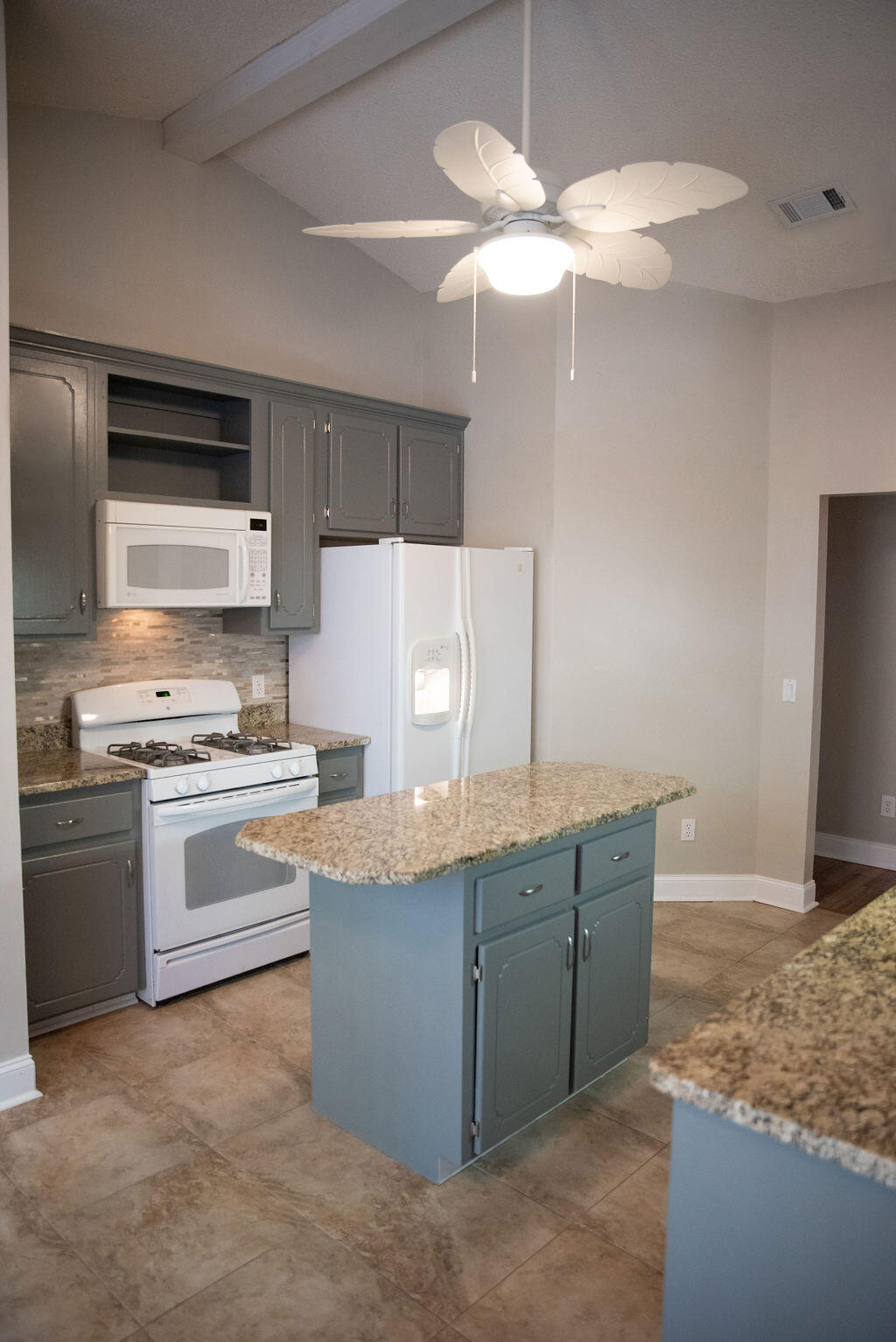4565 Parkwood Court Niceville, FL 32578 - Photo 21 of 48 a kitchen with stainless steel appliances granite countertop a sink a stove and a refrigerator