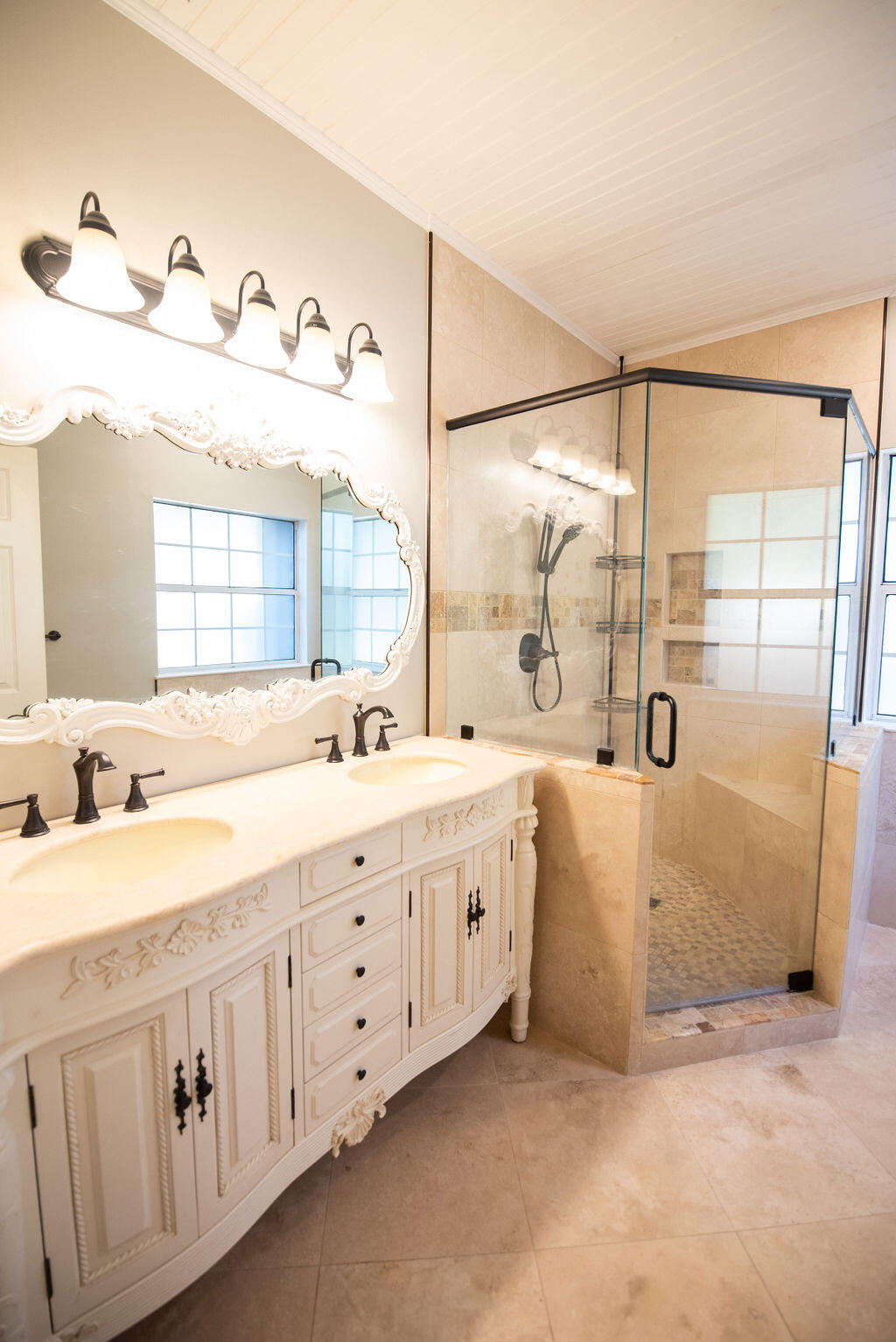 4565 Parkwood Court Niceville, FL 32578 - Photo 30 of 48 a spacious bathroom with double vanity and a mirror