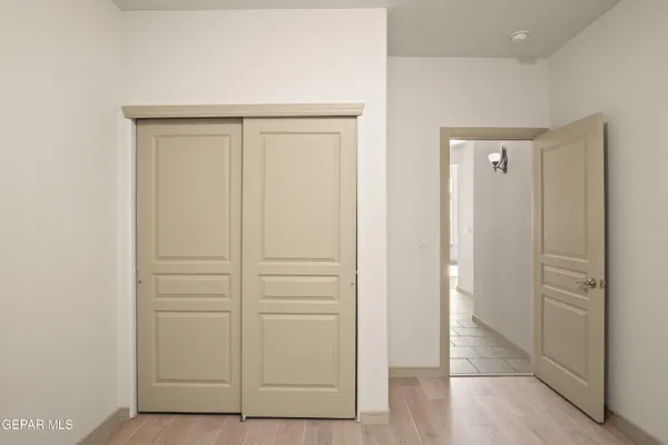an empty room with wooden floor