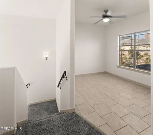 a view of empty room with windows