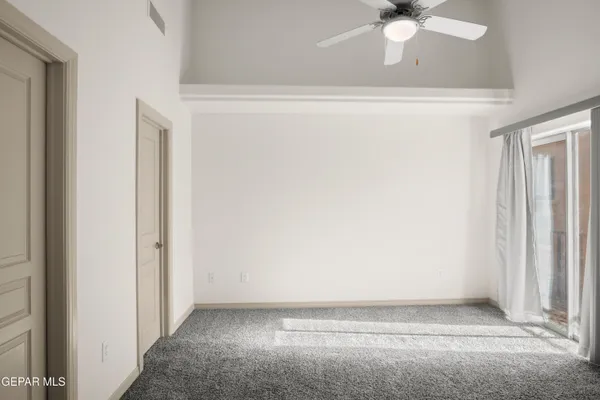 an empty room with sliding door